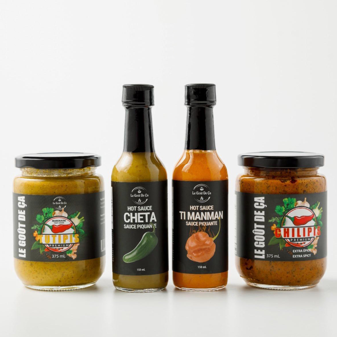 Front view of Le Gout de Ca Flavor Bundle, including Tutipis, Chilipis, Cheta Hot Sauce, and Ti Manman Hot Sauce